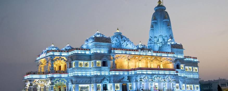 Prem Mandir illuminated at dusk — Vrindavan